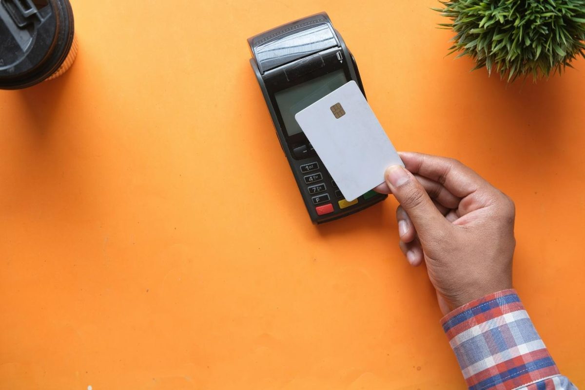 Customer tapping his Card on a Card Terminal for recent transaction