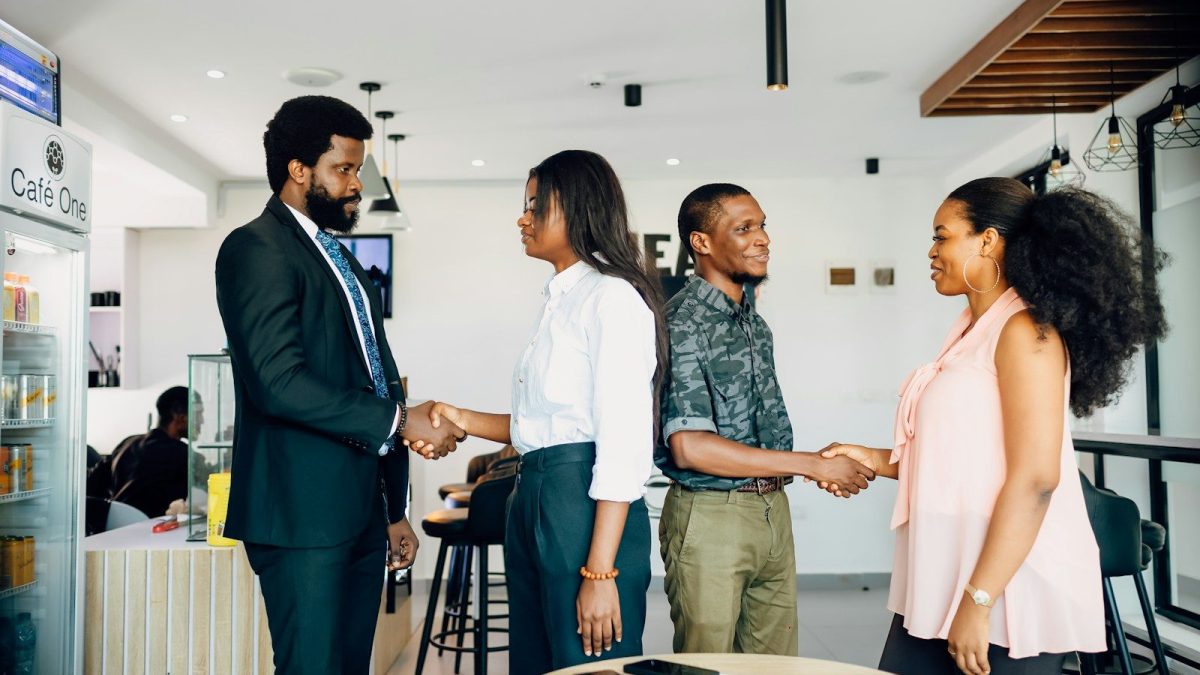 Professionals meeting during customer onboarding process representing KYC services, kyc screening, know your client software, kyc compliance software, and compliance solutions for banks.