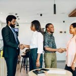 Professionals meeting during customer onboarding process representing KYC services, kyc screening, know your client software, kyc compliance software, and compliance solutions for banks.