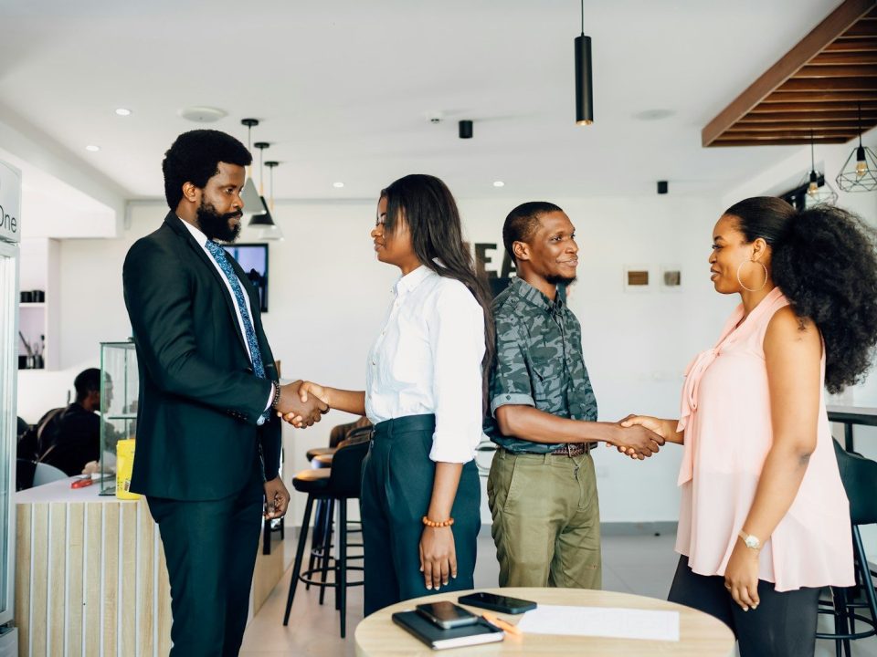 Professionals meeting during customer onboarding process representing KYC services, kyc screening, know your client software, kyc compliance software, and compliance solutions for banks.